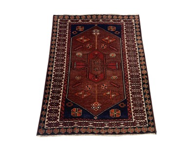Lot 1202 - A North West Persian rug, the field with a...