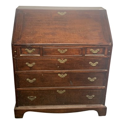 Lot 3330 - A George III oak bureau, the fall front...