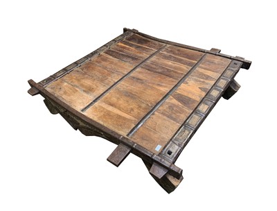 Lot 1053 - A large Indian carved hardwood low table, with...