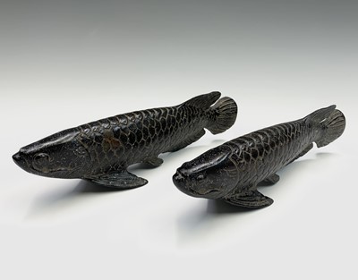 Lot 142 - A pair of Chinese bronze models of carp,...