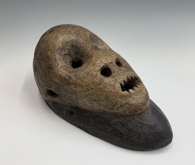 Lot 70 - An unusual carved wood tribal face mask,...