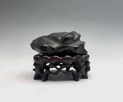 Lot 178 - A Chinese black hardstone 'Scholars Rock', on...