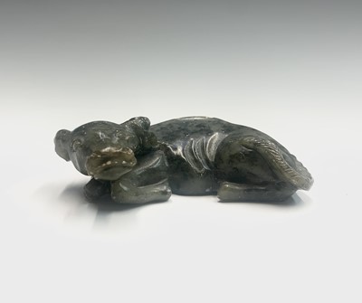 Lot 156 - A Chinese soapstone carving of a recumbent...