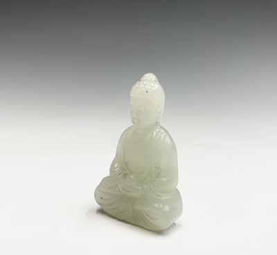 Lot 63 - A small Chinese jade figure of a seated Buddha,...