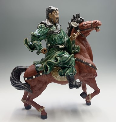 Lot 155 - A large Chinese pottery figure of a warrior on...
