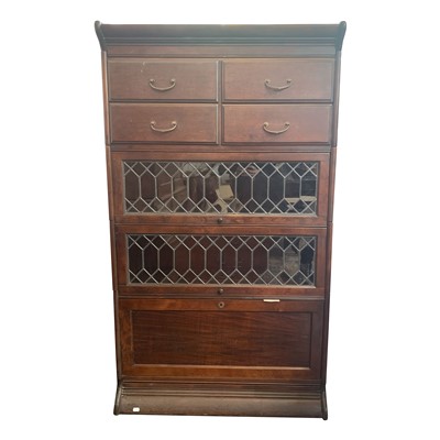 Lot 3362 - A mahogany sectional bookcase, the top section...