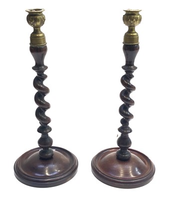 Lot 34 - A pair of mahogany barley twist candlesticks,...