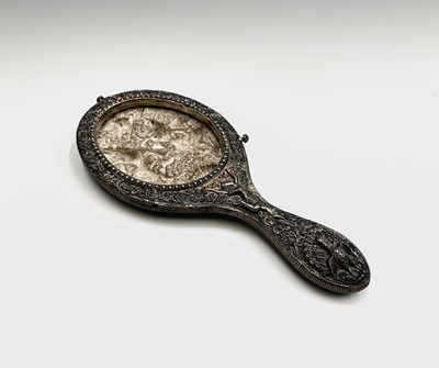 Lot 1025 - A Burmese silver hand mirror frame, circa 1900,...