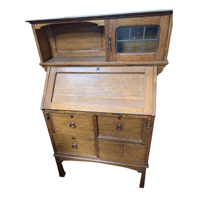 Lot 3338 - An Arts and Crafts oak bureau, with a single...
