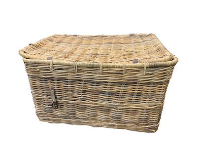 Lot 208 - A wicker laundry basket, the lid with leather...