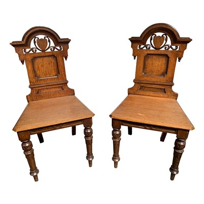 Lot 3343 - A pair of Victorian oak hall chairs, height...