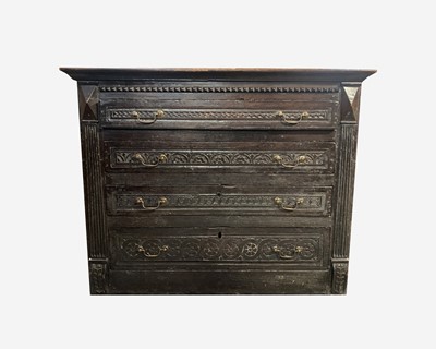 Lot 40 - A Georgian carved oak chest of drawers, with...