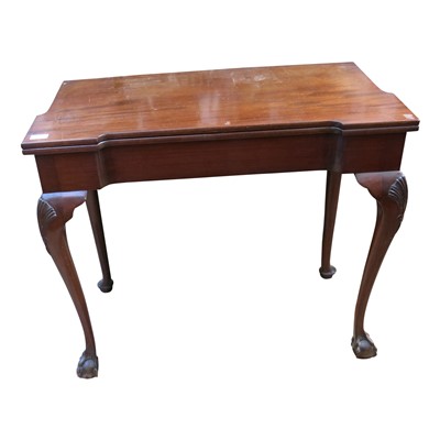 Lot 3353 - A mahogany fold over card table, 19th century,...