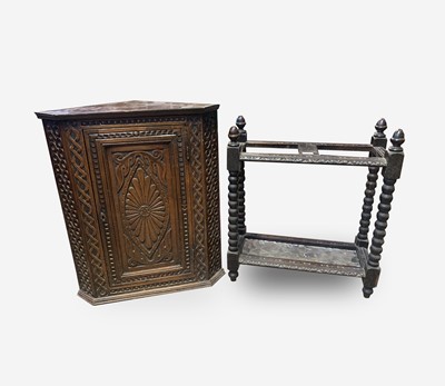 Lot 74 - A George III carved oak corner cupboard, with...