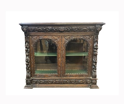 Lot 63 - A Victorian carved oak display cabinet, with...
