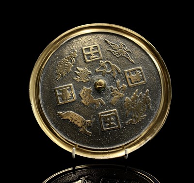 Lot 210 - A Chinese polished bronze mirror, diameter 21cm.