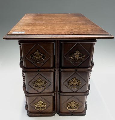 Lot 73 - A Continental walnut miniature chest of...
