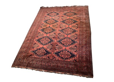 Lot 1236 - An Afghan carpet, mid 20th century, the madder...