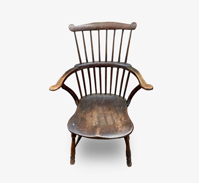 Lot 75 - An ash and elm 'comb back' Windsor armchair,...
