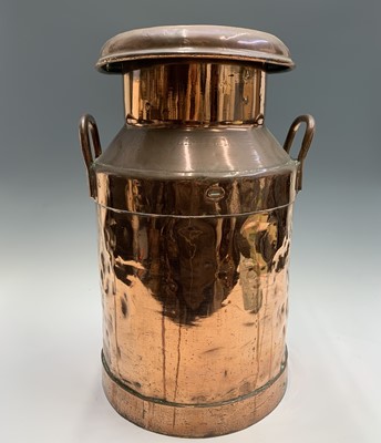 Lot 33 - A copper five gallon milk churn, the lid...