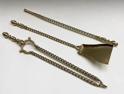 Lot 95 - A set of three Victorian brass fire irons,...