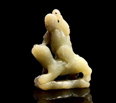 Lot 47 - A Chinese jade carving of a diminutive figure,...