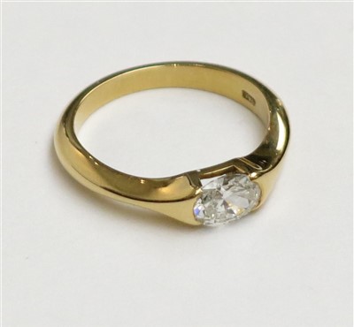 Lot 2411 - An 18ct gold post-war ring set with an oval...