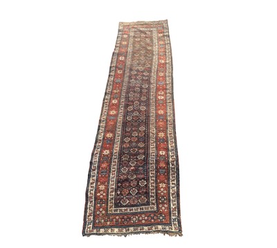 Lot 1230 - A Kurdish runner, circa 1900, the indigo...