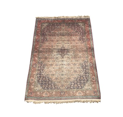 Lot 1229 - A Tabriz rug, West Persia, the madder field,...