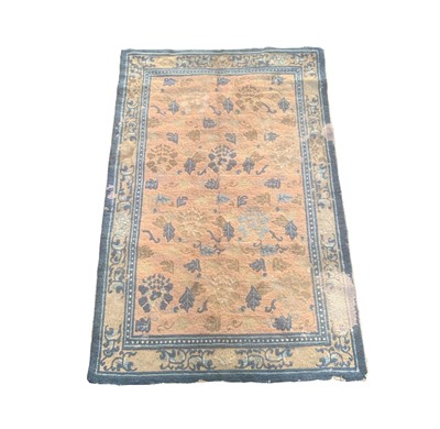 Lot 1231 - A Chinese rug, 19th century, the salmon field...