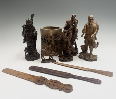 Lot 275 - A Chinese hardwood figure of Shoulao, holding...