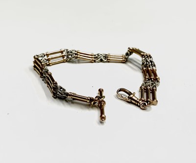 Lot 122 - A 9ct two colour gold watch chain with triple...