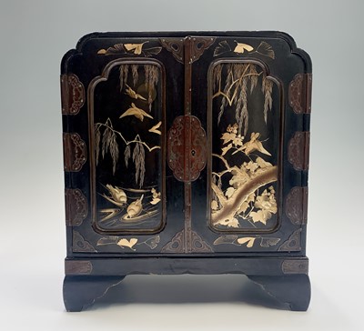 Lot 40 - A Japanese gilt and black lacquered table...