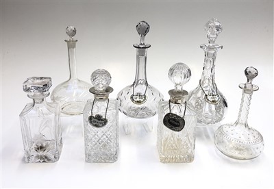 Lot 1031 - A collection of seven glass decanters together...