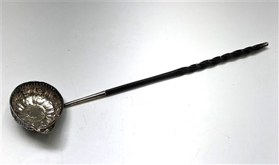 Lot 2166 - An 18th century silver punch ladle with...