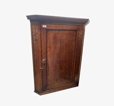 Lot 64 - A George III oak and fruitwood banded corner...