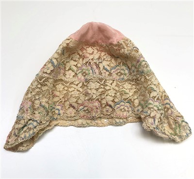 Lot 3228 - An early 20th century foliate lace night cap...