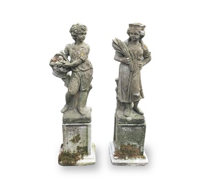 Lot 605 - A pair of reconstituted stone garden statues,...