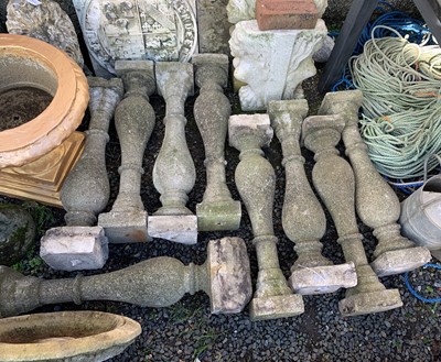Lot 613 - Eight composition stone balustrades. Height 74cm.