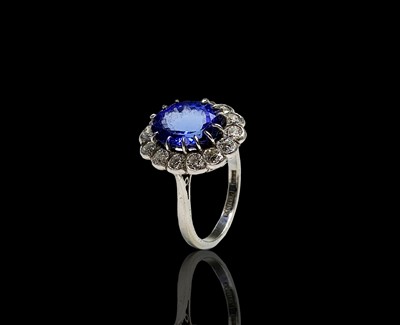 Lot 126 - A fine platinum, tanzanite and diamond oval...