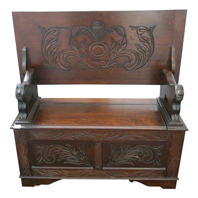 Lot 3401 - A carved oak monks bench, 20th century, height...