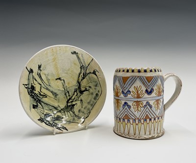 Lot 871 - A stoneware mug with incised decoration,...