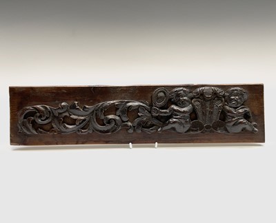 Lot 102 - A carved oak rectangular panel, 19th century,...