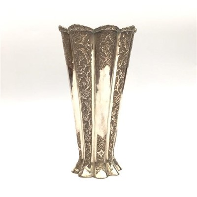 Lot 2121 - An eastern silver coloured metal vase.