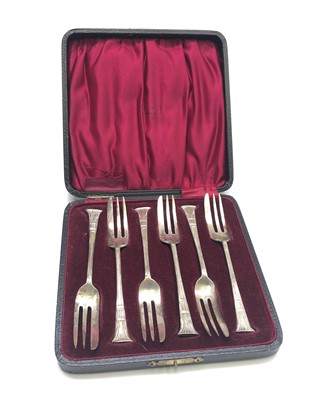Lot 2183 - A set of six silver cake forks with...