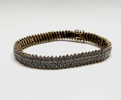 Lot 119 - A 9ct gold bracelet set with over 200 small...