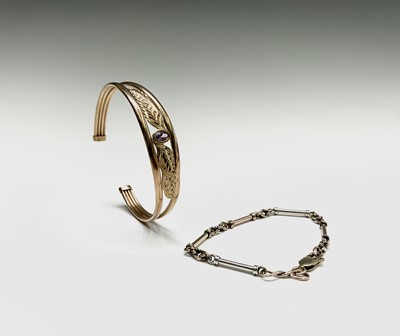 Lot 107 - A 9ct gold bracelet and a 9ct gold bangle set...