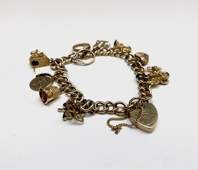 Lot 132 - A 9ct gold charm bracelet 29.9gm