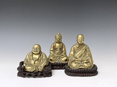 Lot 316 - Three Chinese brass buddahs, early 20th...