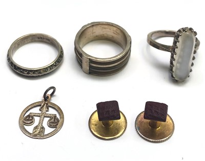 Lot 2699 - An elephant hair ring, a silver moonstone set...